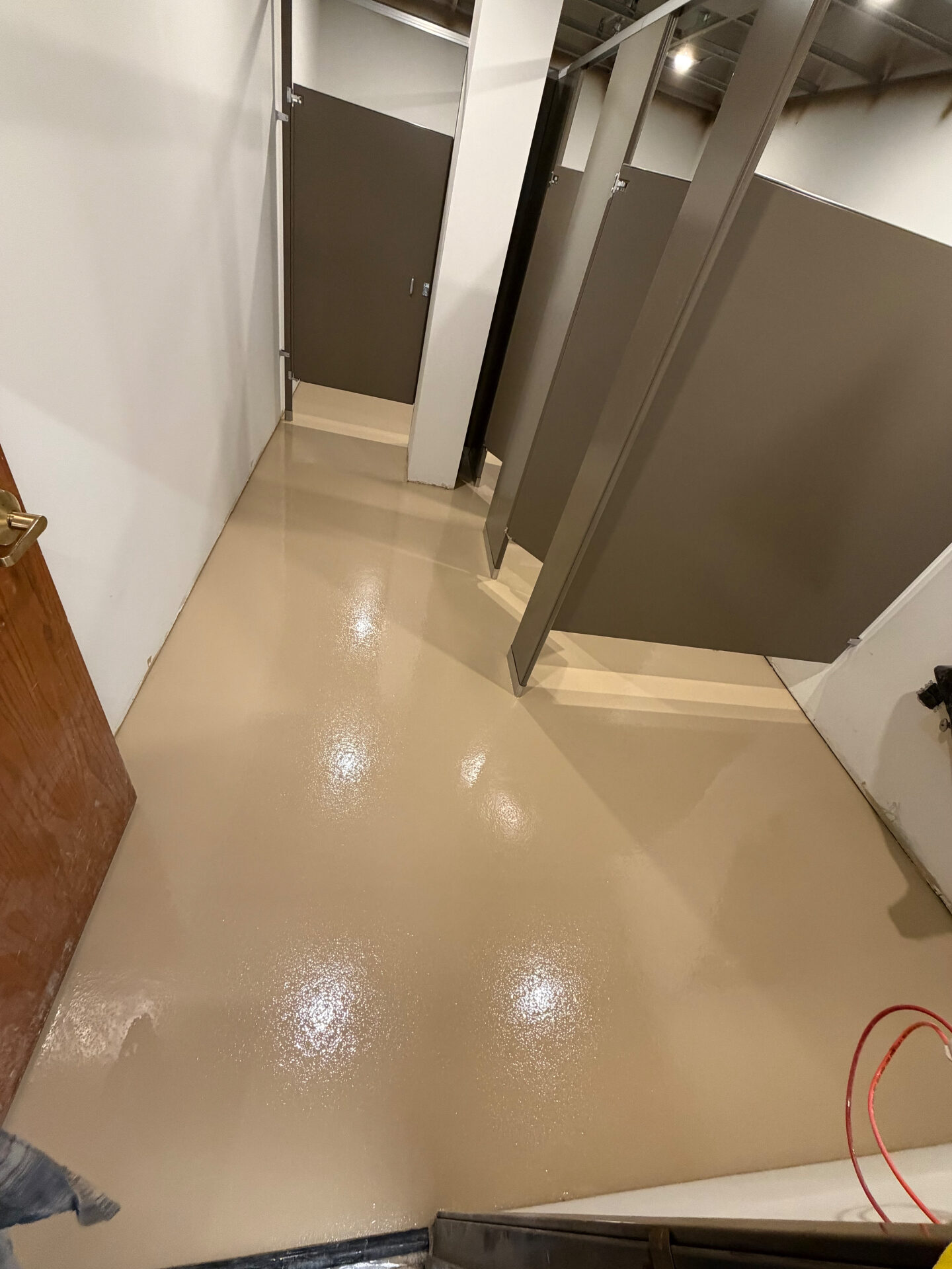 Solid Color Epoxy Coating — Commercial Restroom after installation - high gloss finished concrete coating