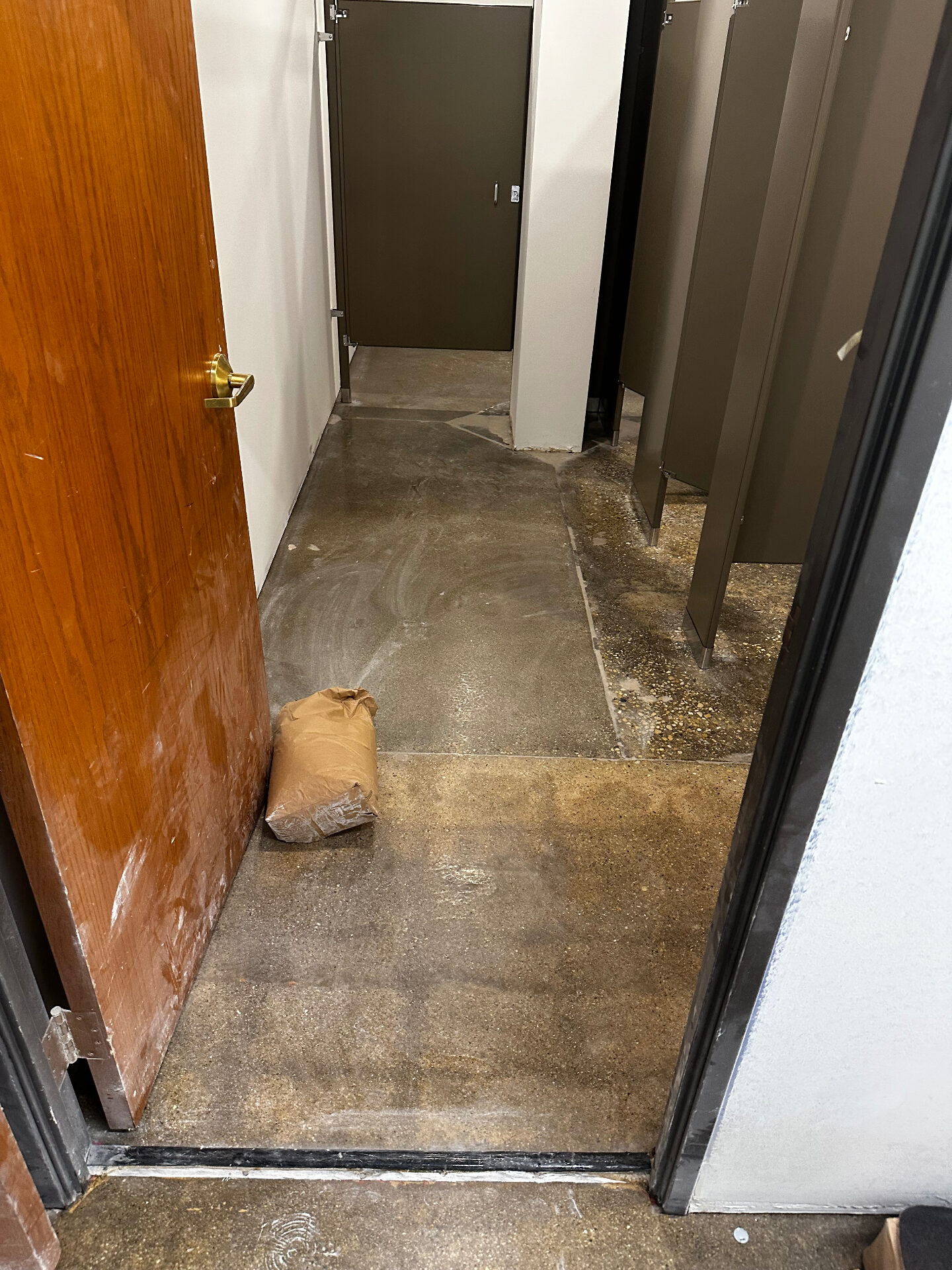 Solid Color Epoxy Coating — Commercial Restroom before installation - raw unfinished concrete surface