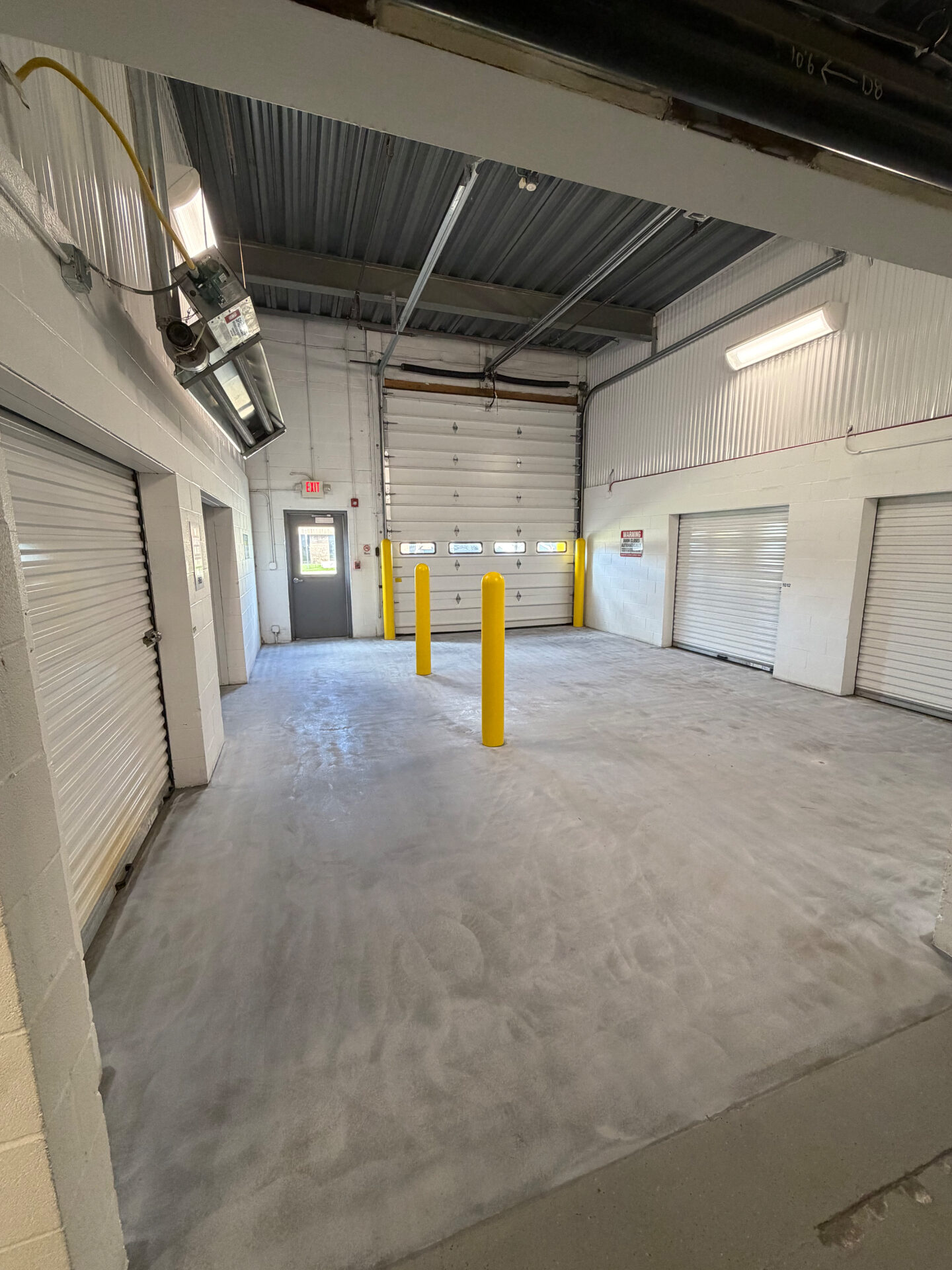 Full Broadcast Flake — Commercial Storage Facility before installation - raw unfinished concrete surface